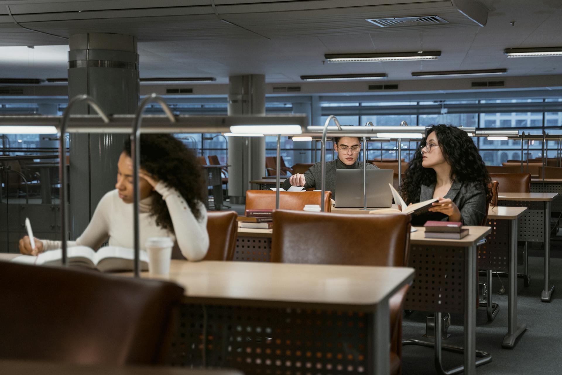CNAM banner - modern library study desks